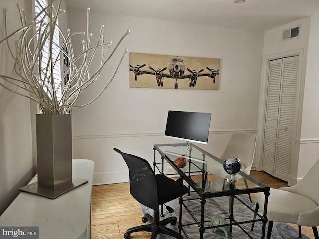 office space with hardwood / wood-style flooring