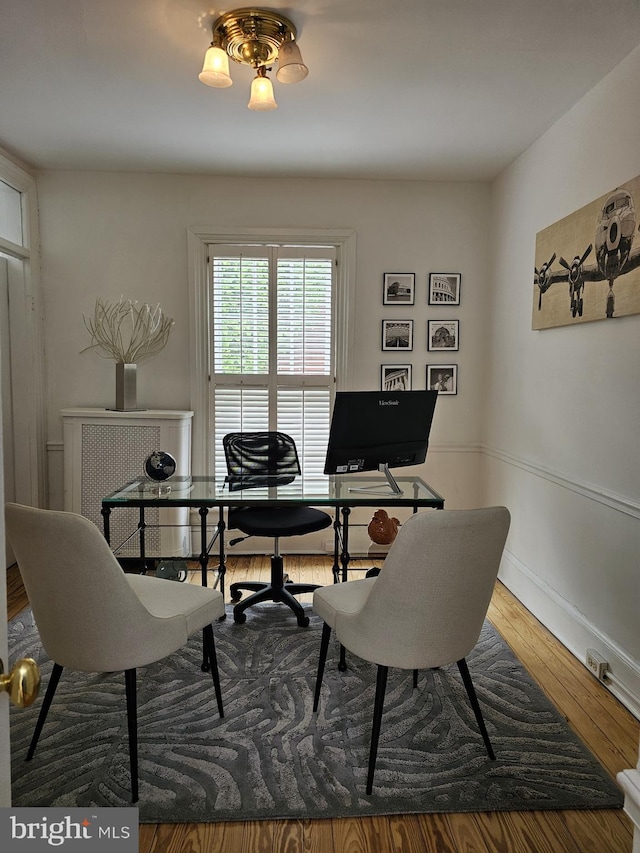 office with hardwood / wood-style flooring