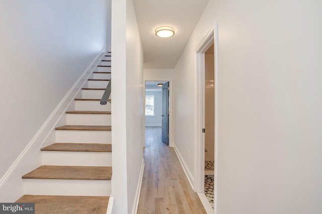 staircase featuring light hardwood / wood-style flooring