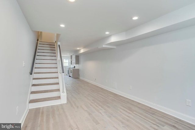 basement featuring light hardwood / wood-style floors