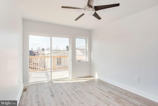 spare room featuring light hardwood / wood-style flooring and ceiling fan