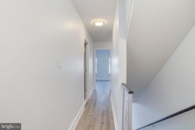 corridor with light wood-type flooring