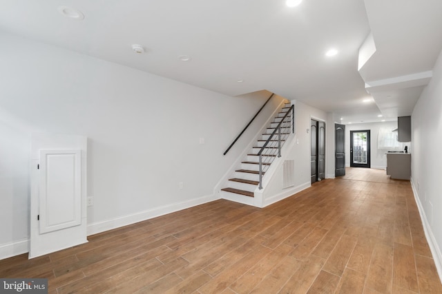 basement featuring light hardwood / wood-style flooring