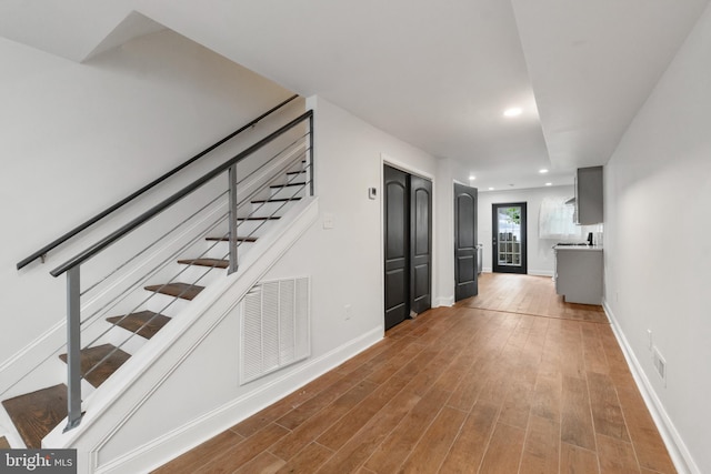 stairs with wood-type flooring