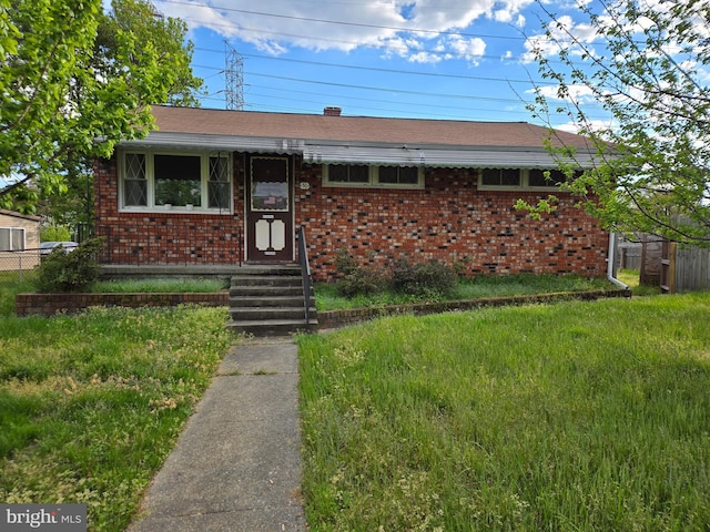 single story home with a front yard