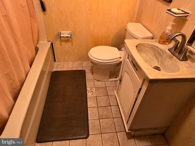 full bathroom featuring wood walls, shower / bath combo, tile floors, vanity, and toilet