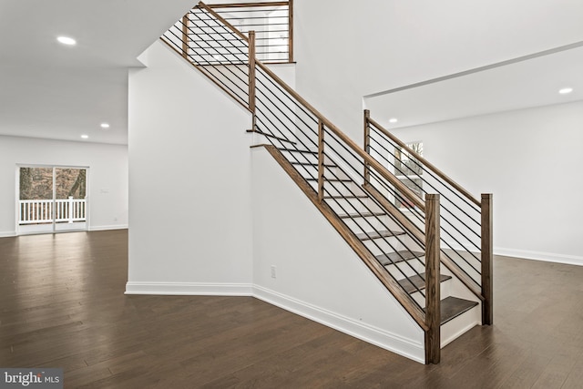 stairs featuring wood-type flooring