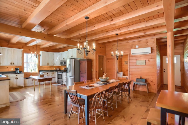 dining area with a wall unit AC, beam ceiling, wooden walls, and a notable chandelier