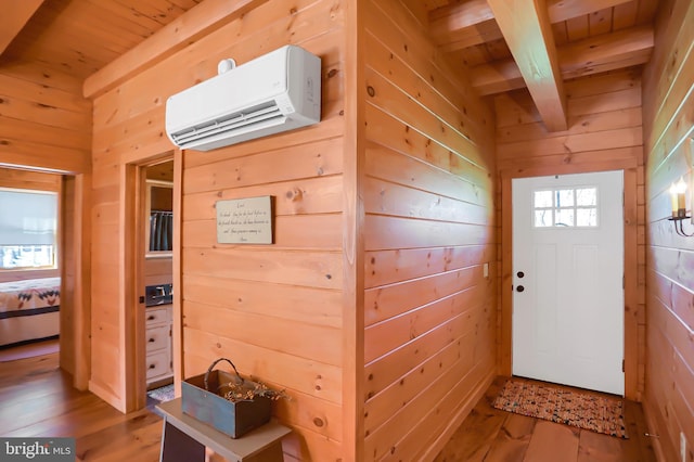 interior space featuring wooden ceiling, hardwood / wood-style floors, a wall unit AC, and wooden walls