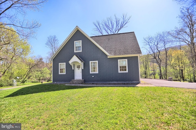 front facade with a front yard