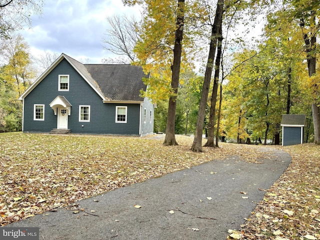 view of front of home with a storage unit