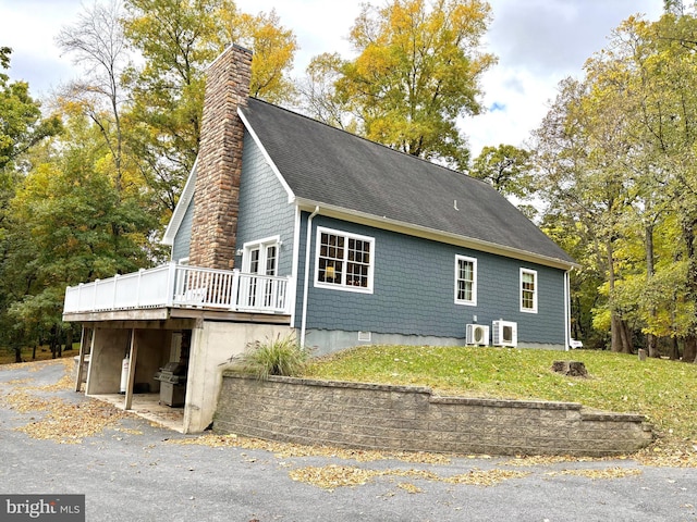 view of home's exterior featuring a deck