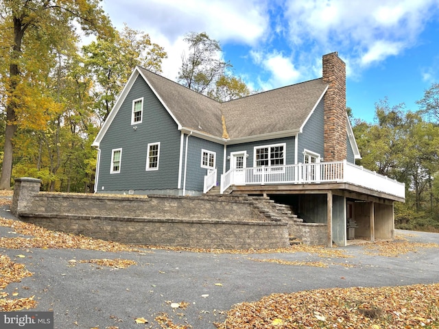 view of front of property featuring a wooden deck