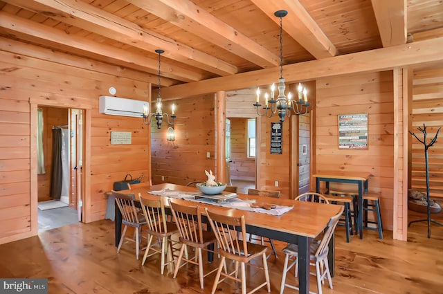 dining area with wooden walls, beamed ceiling, an inviting chandelier, and a wall mounted air conditioner