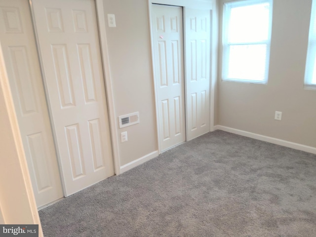 unfurnished bedroom featuring light colored carpet