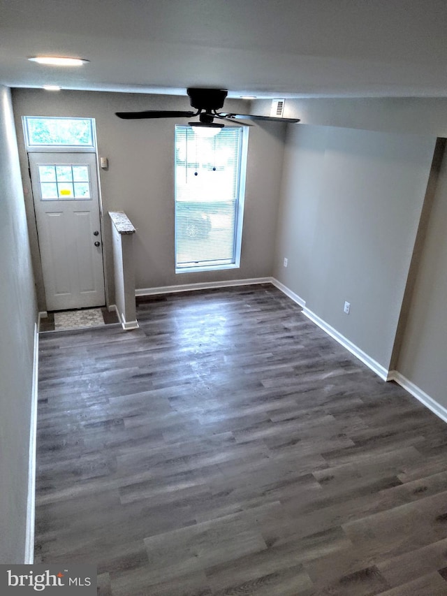 entryway with ceiling fan and dark hardwood / wood-style flooring