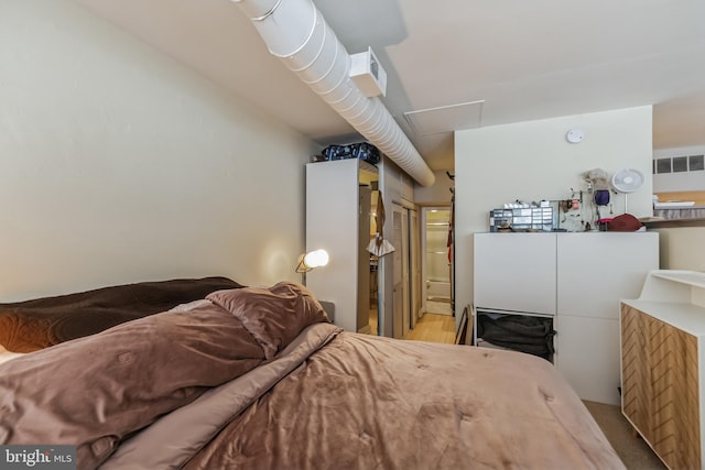 bedroom featuring hardwood / wood-style floors