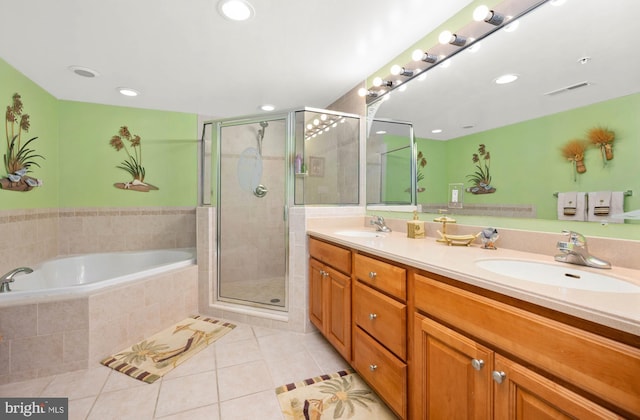 bathroom featuring tile patterned flooring, vanity, and independent shower and bath