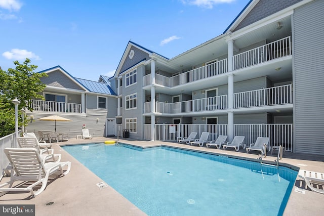 view of pool featuring a patio