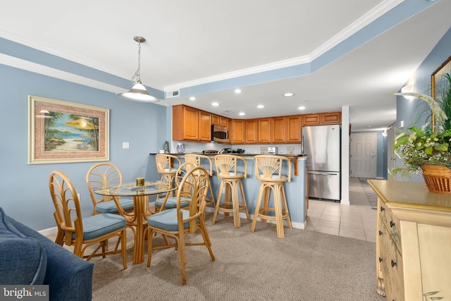 tiled dining area with crown molding