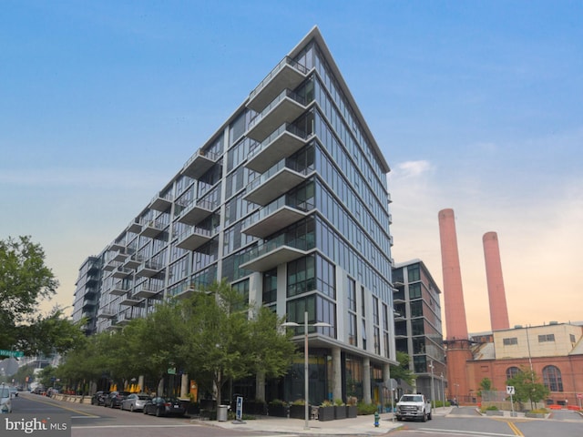 view of outdoor building at dusk