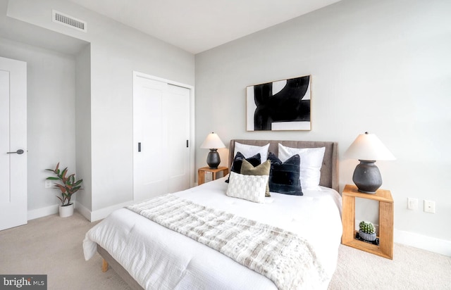 carpeted bedroom featuring a closet