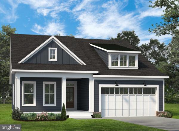 view of front facade featuring a garage and a front yard