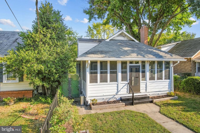 bungalow-style home featuring a sunroom