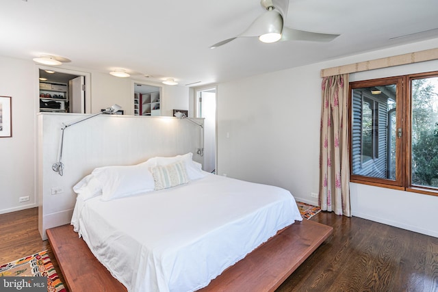 bedroom featuring dark hardwood / wood-style floors and ceiling fan