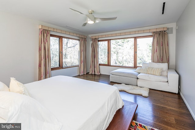 bedroom featuring dark wood-type flooring and ceiling fan