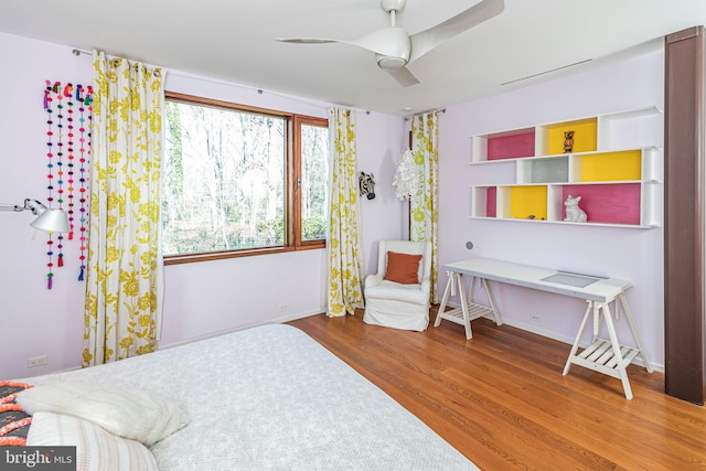 bedroom featuring ceiling fan and hardwood / wood-style flooring