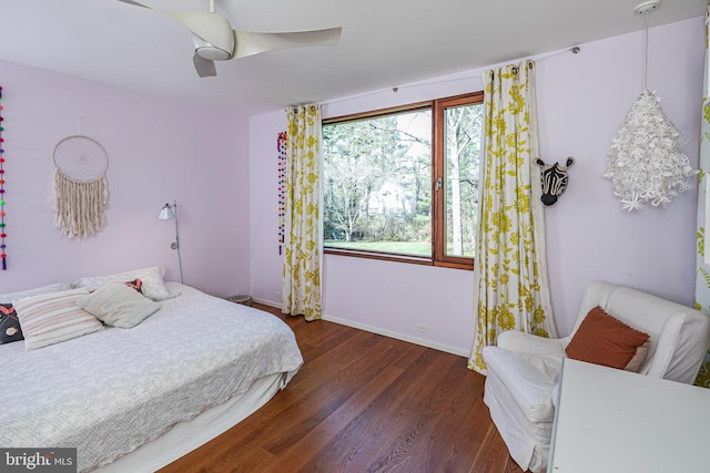 bedroom featuring ceiling fan and dark hardwood / wood-style flooring