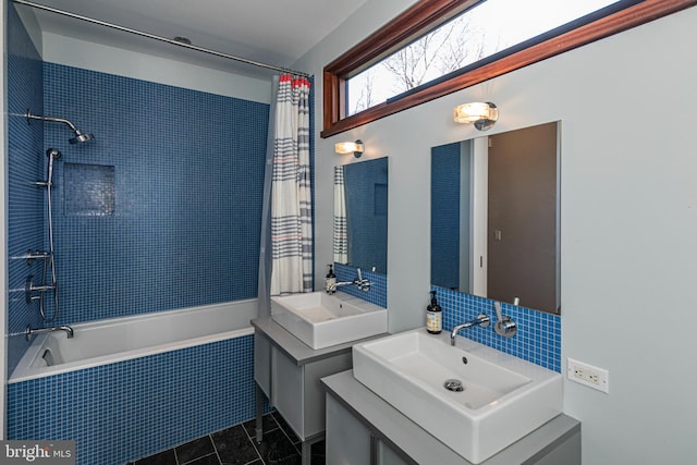 bathroom with shower / bath combo, dual bowl vanity, and tile flooring