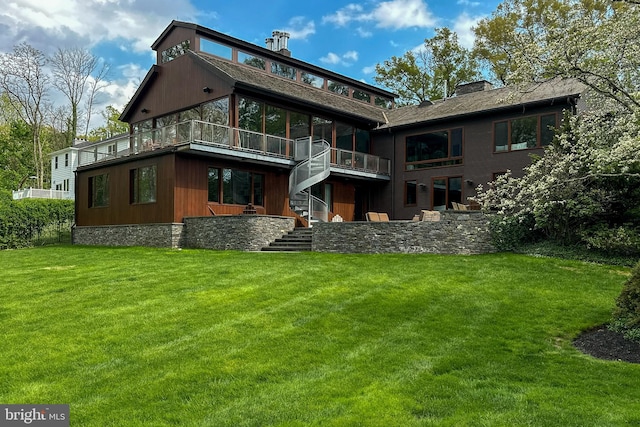 rear view of property featuring a yard