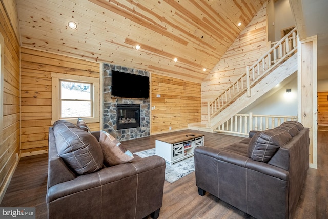 living room with a fireplace, wood ceiling, wood walls, and hardwood / wood-style floors