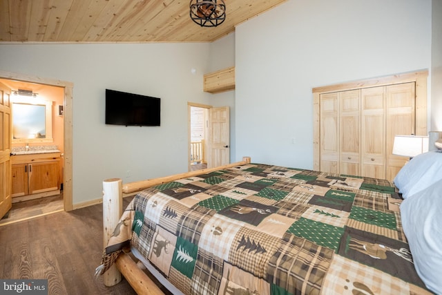 bedroom featuring high vaulted ceiling, hardwood / wood-style flooring, a closet, and wood ceiling