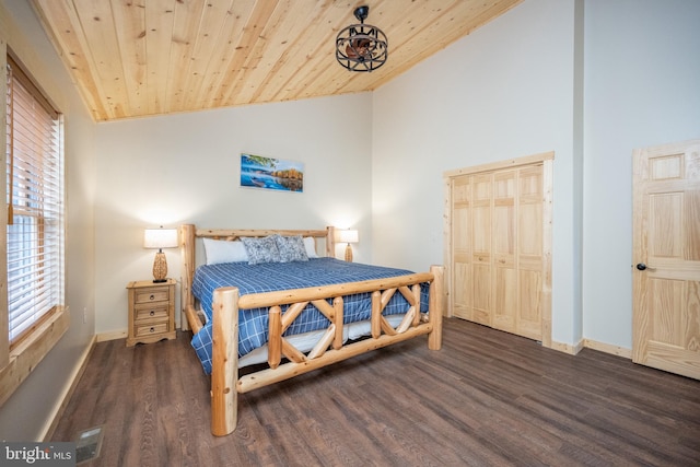 bedroom featuring wooden ceiling, dark hardwood / wood-style floors, and vaulted ceiling