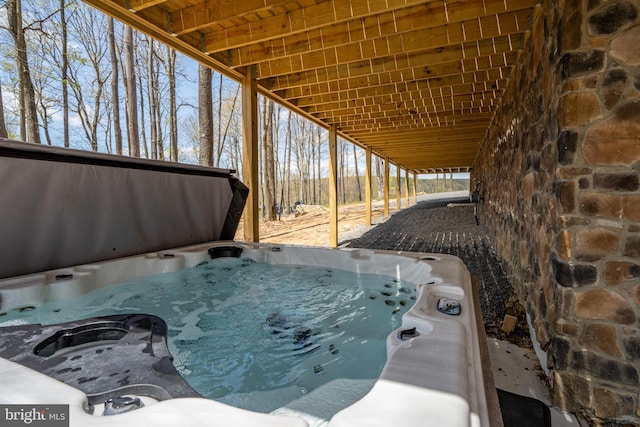 exterior space with a hot tub