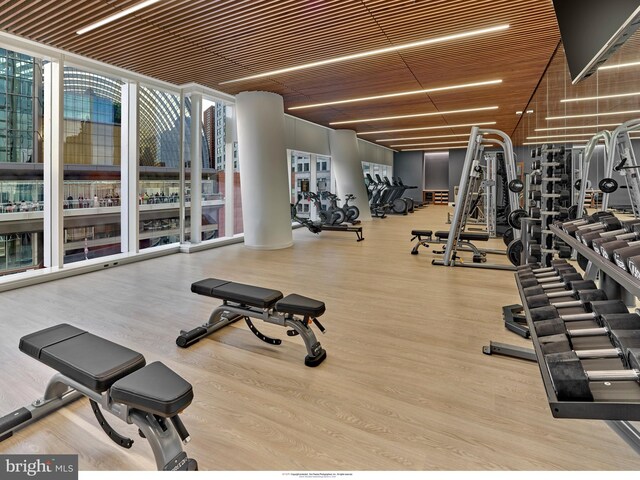 301 S Broad Unit 804, Philadelphia, PA 19107 - gym featuring wood ceiling, plenty of natural light, expansive windows, and hardwood / wood-style floors