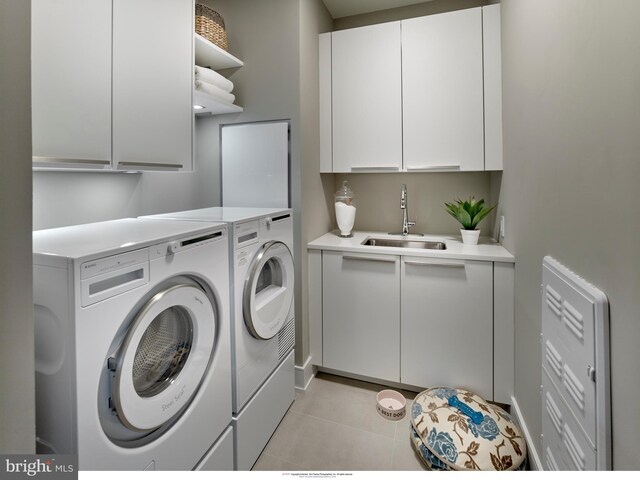 301 S Broad Unit 804, Philadelphia, PA 19107 - laundry room featuring independent washer and dryer, sink, light tile flooring, and cabinets