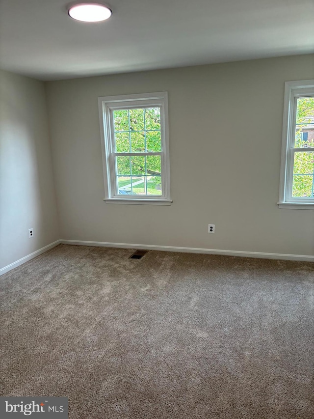 3820 V St SE Unit 202, Washington, DC 20020 - carpeted empty room featuring baseboards