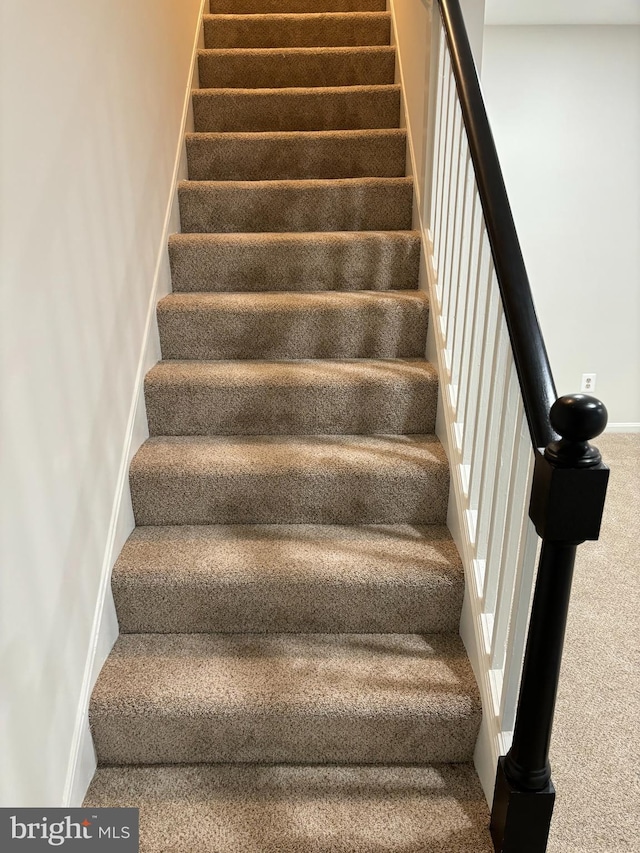 3820 V St SE Unit 202, Washington, DC 20020 - staircase featuring carpet flooring and baseboards