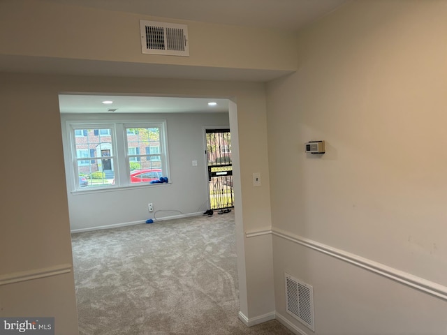 hallway with light carpet