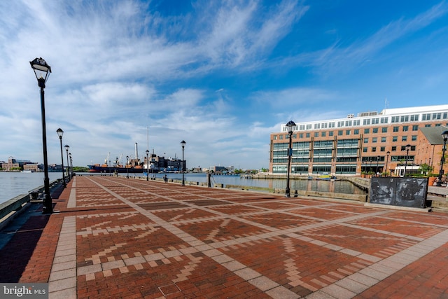 surrounding community featuring a water view