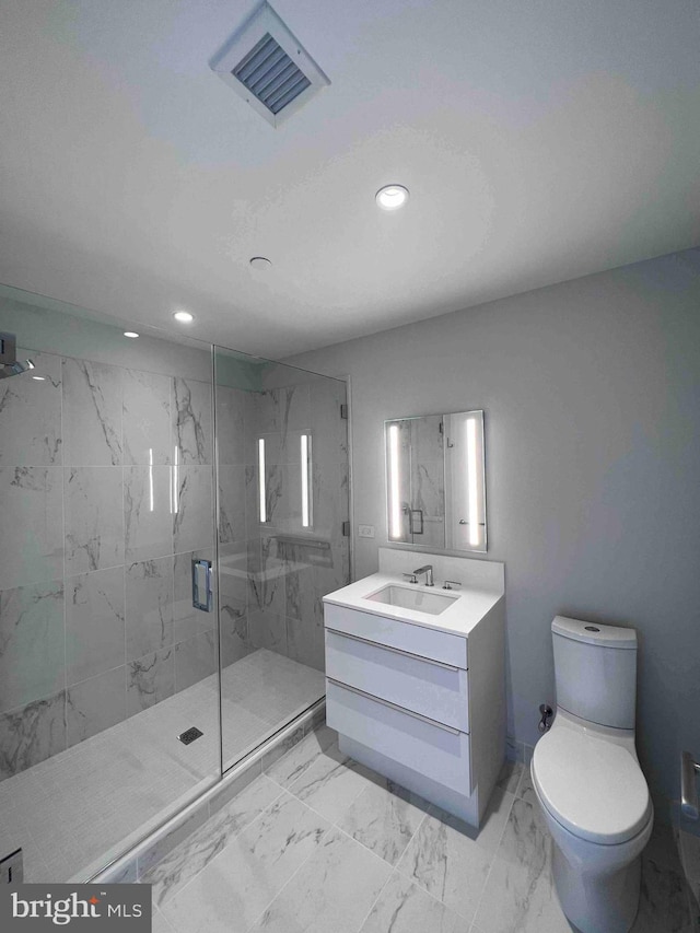 bathroom with tile flooring, an enclosed shower, vanity, and toilet