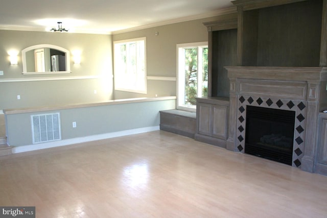 1707 Bay St, Fenwick Island, DE 19944 - unfurnished living room with ornamental molding, visible vents, wood finished floors, and a fireplace