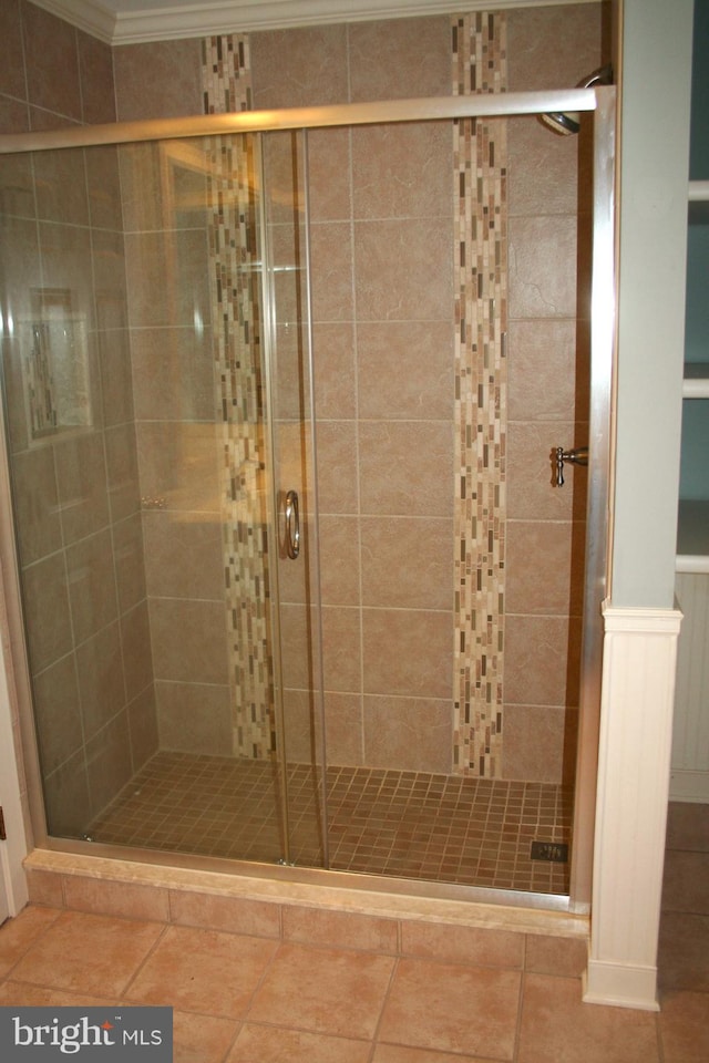 1707 Bay St, Fenwick Island, DE 19944 - bathroom with a stall shower, ornamental molding, and tile patterned flooring