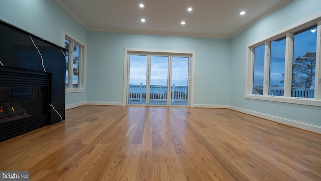 1707 Bay St, Fenwick Island, DE 19944 - unfurnished living room with baseboards, ornamental molding, and recessed lighting