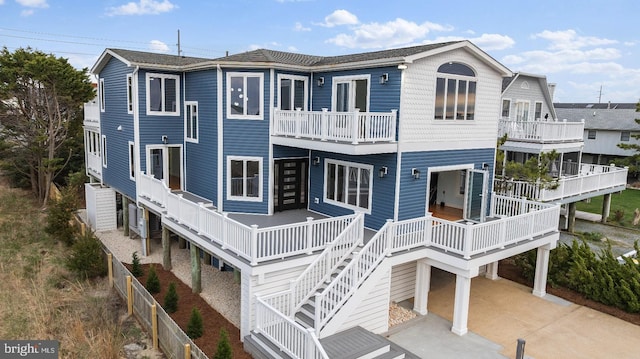 1707 Bay St, Fenwick Island, DE 19944 - rear view of property with driveway and stairway