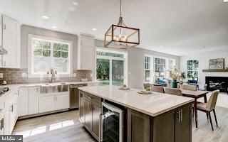 4712 Carroll Manor Rd, Baldwin, MD 21013 - kitchen featuring beverage cooler, plenty of natural light, dishwasher, a sink, and recessed lighting